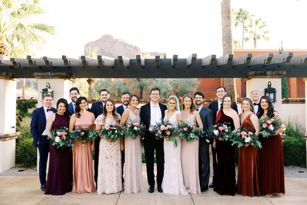 Bride, groom and bridal party at Valencia Lawn pergola at Omni Montelucia Resort in Scottsdale.