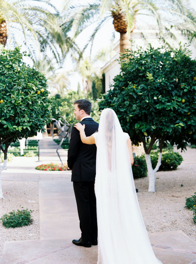 bride touching groom's shoulder at Omni Scottsdale