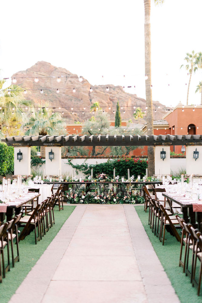 Fall outdoor wedding head table with flowers at Omni Scottsdale