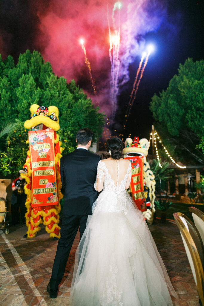 wedding couple watch fireworks at their Royal Palms wedding