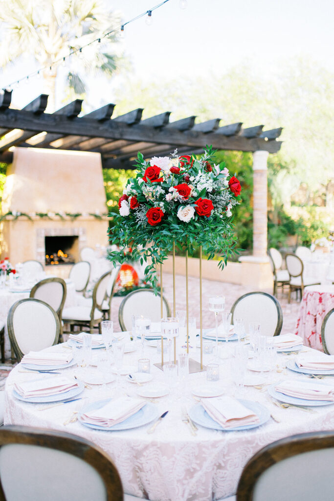 wedding reception tablescape with tall floral arrangements 
